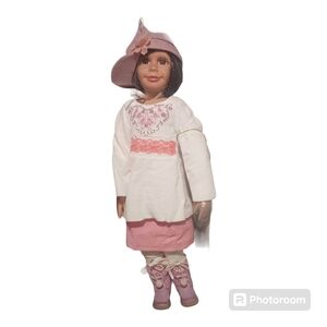 Adorable Pink and White Doll with Knitted Top and Striped Leggings